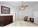 Bright bedroom with yellow patterned bedspread, ceiling fan, and dark wood dresser at 20031 N 22Nd Pl, Phoenix, AZ 85024
