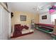 Small bedroom with a futon, shelving unit, and a window at 20031 N 22Nd Pl, Phoenix, AZ 85024