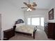 Spacious main bedroom featuring a fan, large window, and dark wood furniture at 20031 N 22Nd Pl, Phoenix, AZ 85024