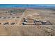 Aerial view of new homes and lots in a desert community at 23197 W Skinner Rd, Wittmann, AZ 85361