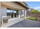 Covered patio with sliding glass doors leading to the backyard at 2357 W Gloria Ln, Phoenix, AZ 85085