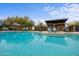 Community pool with surrounding lounge chairs and restrooms at 2357 W Gloria Ln, Phoenix, AZ 85085