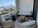 Cozy balcony with cushioned seating and a coffee table is ideal for unwinding and enjoying the outdoor ambiance at 2511 W Queen Creek Rd # 377, Chandler, AZ 85248