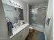 Clean bathroom with a tub shower combo and white vanity at 2511 W Queen Creek Rd # 377, Chandler, AZ 85248