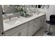 Double vanity bathroom with white cabinets and a large mirror at 2511 W Queen Creek Rd # 377, Chandler, AZ 85248