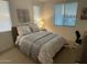 Cozy bedroom with a queen bed and soft color palette at 2511 W Queen Creek Rd # 377, Chandler, AZ 85248