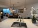 Kitchen features a large island with a white quartz countertop and modern sink at 2511 W Queen Creek Rd # 377, Chandler, AZ 85248