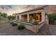 Landscaped backyard with covered patio and artificial turf at 2562 N 169Th Ave, Goodyear, AZ 85395