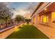 Backyard with covered patio, artificial turf, and lighting at 2562 N 169Th Ave, Goodyear, AZ 85395