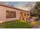 Expansive backyard with covered patio, built-in grill, and decorative landscaping at 2562 N 169Th Ave, Goodyear, AZ 85395