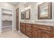 Bathroom boasts double sinks, granite countertops, and ample storage at 2562 N 169Th Ave, Goodyear, AZ 85395