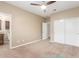 Spacious bedroom with ceiling fan and double door closet at 2562 N 169Th Ave, Goodyear, AZ 85395