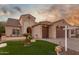 Stunning curb appeal featuring a two-car garage and well-maintained landscaping at 2562 N 169Th Ave, Goodyear, AZ 85395