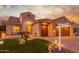 Stunning home exterior with a two-car garage and inviting landscaping at 2562 N 169Th Ave, Goodyear, AZ 85395