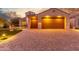 Two-car garage and brick pavers leading to front entry at 2562 N 169Th Ave, Goodyear, AZ 85395