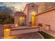 Front entry with ornate iron door and brick pavers at 2562 N 169Th Ave, Goodyear, AZ 85395