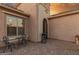 Charming front patio with wrought iron details and seating area at 2562 N 169Th Ave, Goodyear, AZ 85395