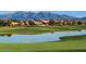 Scenic golf course with water features and homes at 2562 N 169Th Ave, Goodyear, AZ 85395