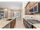 Kitchen with granite countertops, stainless steel appliances, and an island at 2562 N 169Th Ave, Goodyear, AZ 85395