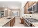 Modern kitchen showcasing stainless steel appliances and granite countertops at 2562 N 169Th Ave, Goodyear, AZ 85395