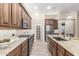 Spacious kitchen featuring granite countertops, stainless steel appliances, and ample cabinetry at 2562 N 169Th Ave, Goodyear, AZ 85395
