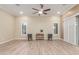 Living room with hardwood floors and ceiling fan at 2562 N 169Th Ave, Goodyear, AZ 85395