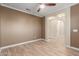 Spacious office with light taupe walls and wood-look tile floor at 2562 N 169Th Ave, Goodyear, AZ 85395