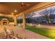 Covered patio with fireplace and seating area at 2562 N 169Th Ave, Goodyear, AZ 85395
