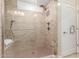 Spacious shower with dual shower heads and built-in seat at 2562 N 169Th Ave, Goodyear, AZ 85395