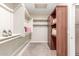 Large walk-in closet with custom shelving and hanging rods at 2562 N 169Th Ave, Goodyear, AZ 85395