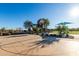 Outdoor basketball court with shaded seating area nearby at 25823 N 122Nd Ln, Peoria, AZ 85383