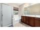 Bathroom features a large vanity and soaking tub at 25823 N 122Nd Ln, Peoria, AZ 85383