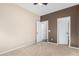 Spacious bedroom with two-toned walls and carpet flooring at 25823 N 122Nd Ln, Peoria, AZ 85383