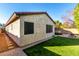 Home's exterior showcasing a tan stucco finish at 25823 N 122Nd Ln, Peoria, AZ 85383