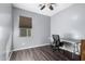 Home office with desk, chair, and built-in shelving at 25823 N 122Nd Ln, Peoria, AZ 85383