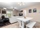 Bright living room features a comfy sofa and a dining area at 25823 N 122Nd Ln, Peoria, AZ 85383
