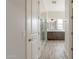 Bathroom shows walk-in shower, double sinks, stylish mirror and open doorway at 29340 N 231St Ave, Wittmann, AZ 85361