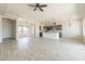 Open-concept space showcasing tile floors, recessed lighting, and a kitchen with stainless steel appliances at 29340 N 231St Ave, Wittmann, AZ 85361