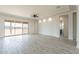 The living room has sliding glass doors, tray ceilings, recessed lighting, and neutral paint at 29340 N 231St Ave, Wittmann, AZ 85361