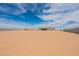 Large lot with a new construction home featuring a covered patio in the background at 29340 N 231St Ave, Wittmann, AZ 85361