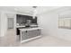 Modern kitchen with island and dark cabinetry at 308 E Hawaii Dr, Casa Grande, AZ 85122