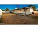 Spacious backyard with covered patio, offering ample outdoor living space and a connection to the home's exterior at 3250 W Mercer N Ln, Phoenix, AZ 85029