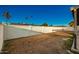 Large backyard enclosed by a white block fence, providing a secure and private outdoor space for recreation and leisure at 3250 W Mercer N Ln, Phoenix, AZ 85029