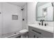Updated bathroom with gray vanity, white subway tile and black fixtures at 3250 W Mercer N Ln, Phoenix, AZ 85029