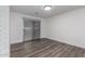 Simple bedroom with hardwood floors and sliding glass door at 3250 W Mercer N Ln, Phoenix, AZ 85029