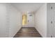 Clean entryway with white brick feature wall and hardwood floors at 3250 W Mercer N Ln, Phoenix, AZ 85029