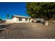 Ranch style home with front yard landscaping and large tree at 3250 W Mercer N Ln, Phoenix, AZ 85029
