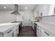 Bright kitchen with white cabinets, quartz countertops and stainless steel appliances at 3250 W Mercer N Ln, Phoenix, AZ 85029