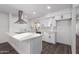 Modern kitchen with white shaker cabinets, quartz countertops, and stainless steel appliances at 3250 W Mercer N Ln, Phoenix, AZ 85029
