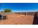 Backyard with gravel and block wall at 36532 W Barcelona Ln, Maricopa, AZ 85138